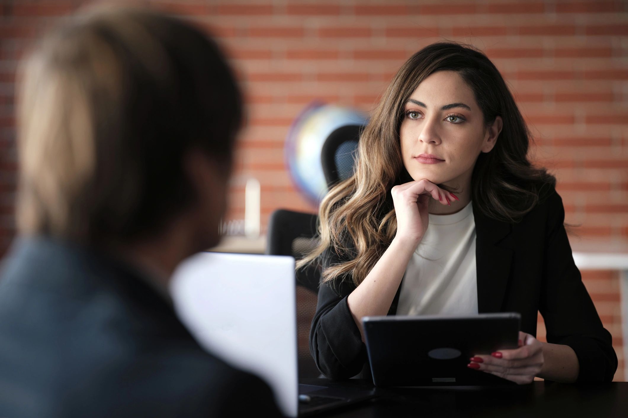 Advisor meeting with a client at a desk